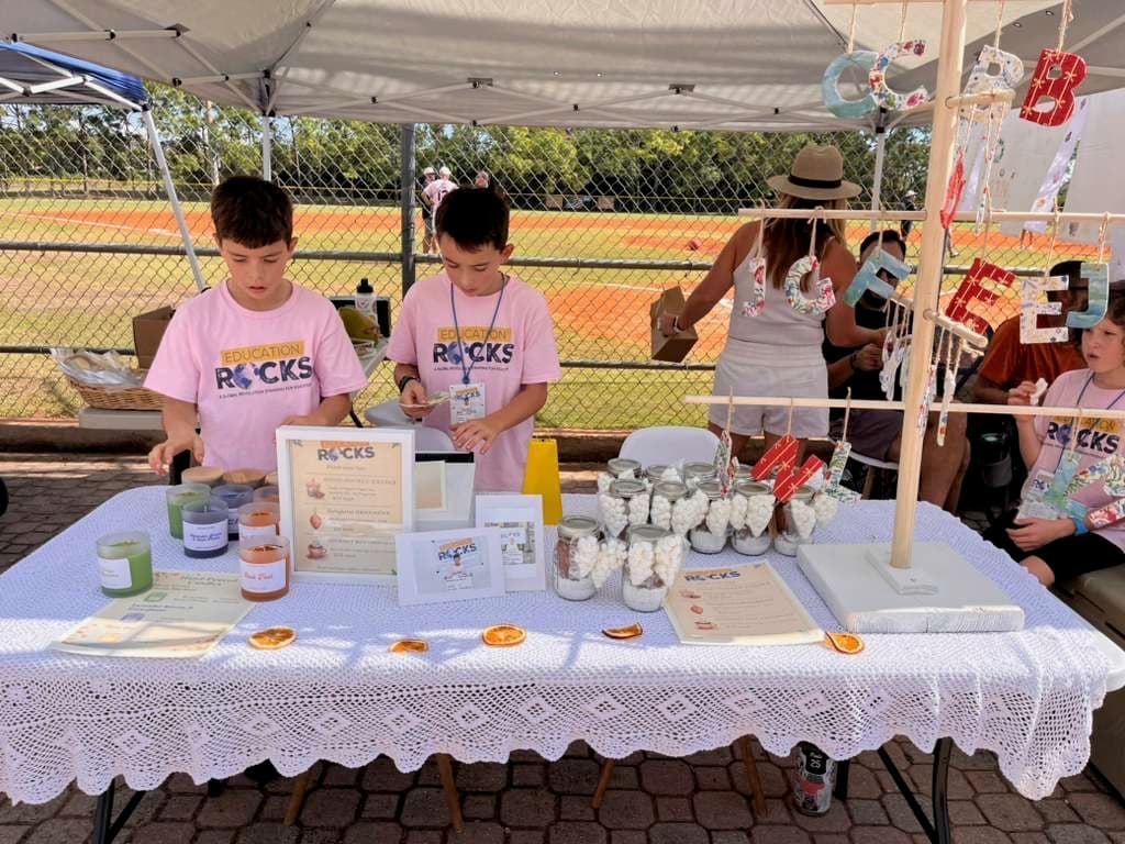 GROW students running their Education Rocks market booth