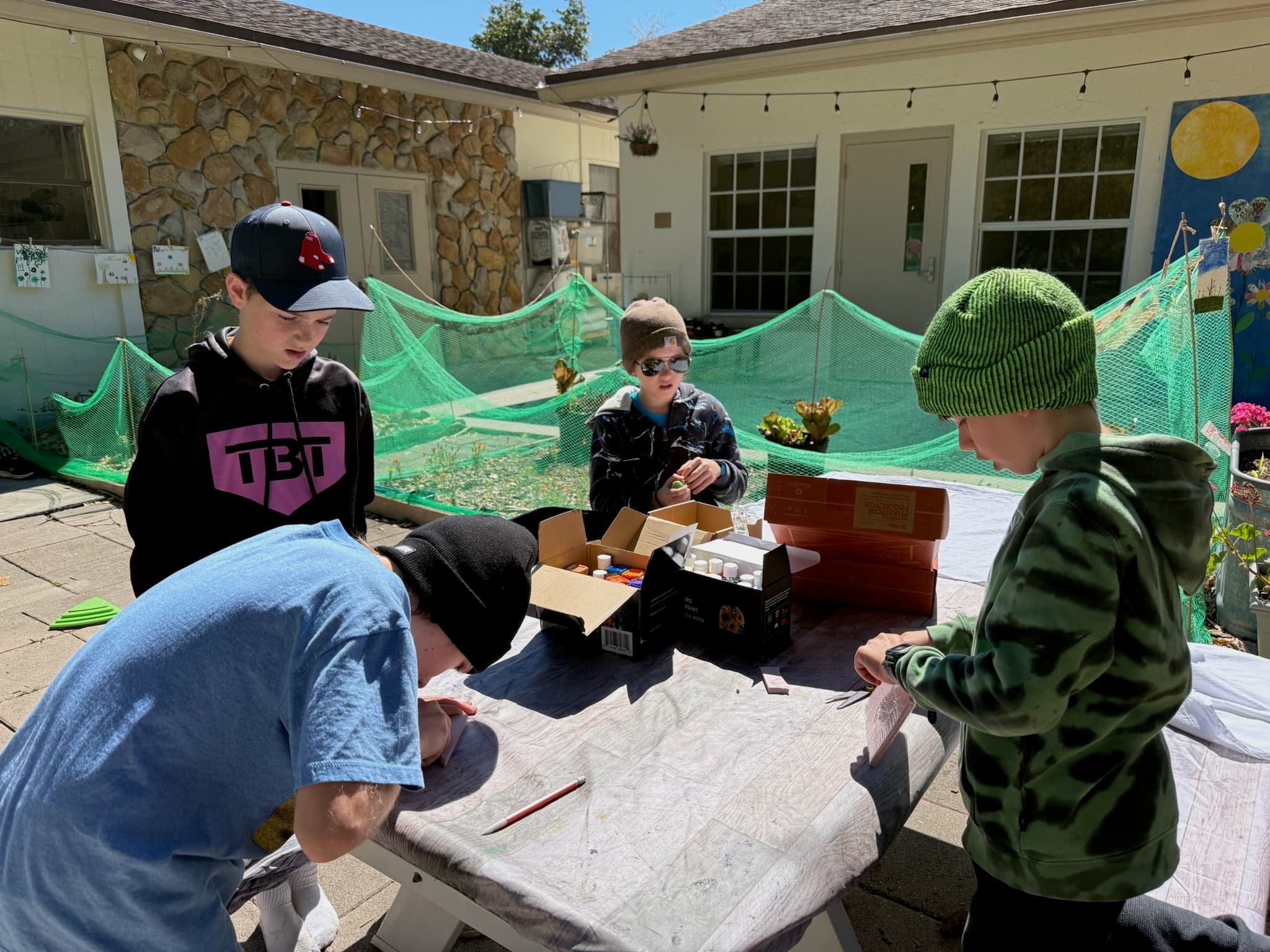 GROW students building their eco-venture project outdoors